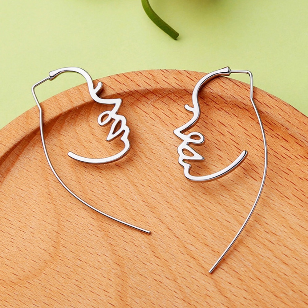 Silver Hollow Face Design Earrings